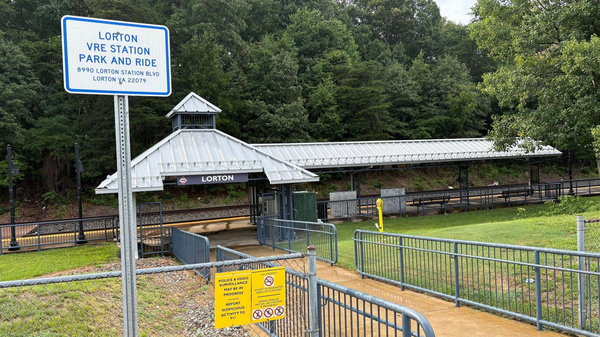 The Lorton VRE Station Park and Ride sign, with the station platform and canopy behind